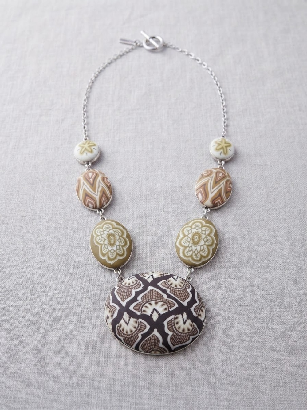 Jill Clay statement Brown Tan Geometric Pattern Silver tone Toggle Clasp.